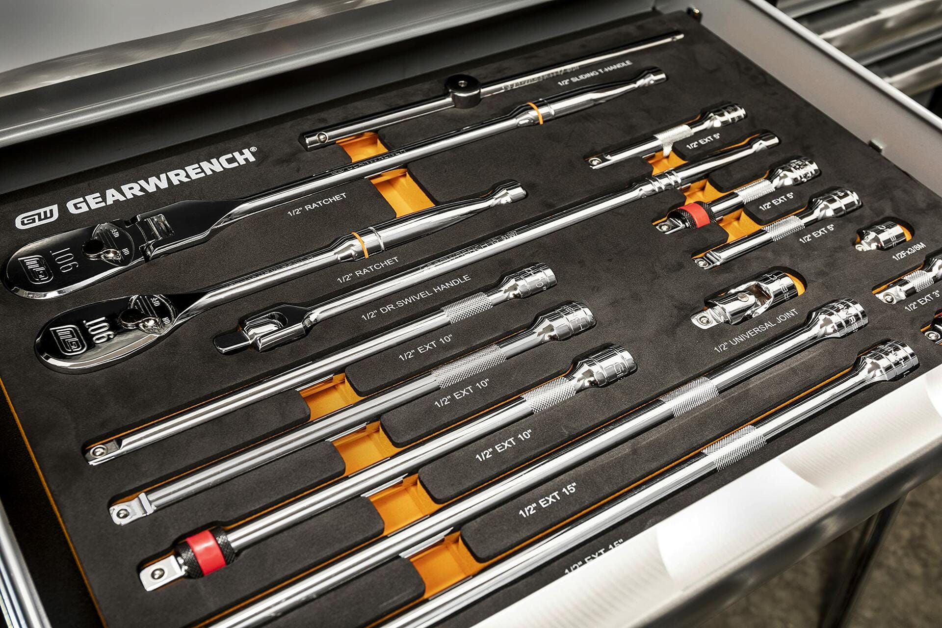 Drawer containing GEARWRENCH ratchets, extension bars, universal joint, and slide handle. Tools are chrome-finished and arranged in labeled foam slots for efficient identification and access