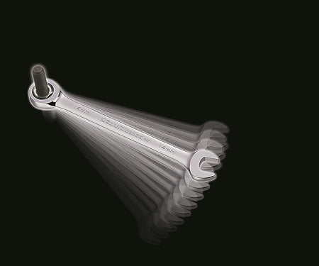 A dynamic, motion-blurred image of a chrome 14mm ratcheting wrench working on a long bolt, illustrating the speed and minimal 5-degree movement of the ratcheting action.