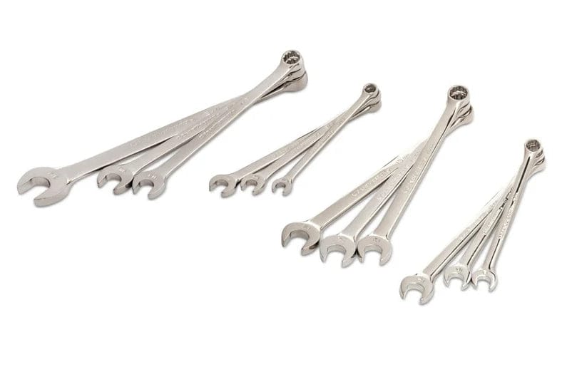 The full set of chrome combination wrenches from the set, arranged in four diagonal groups, showing the offset box ends and open ends.