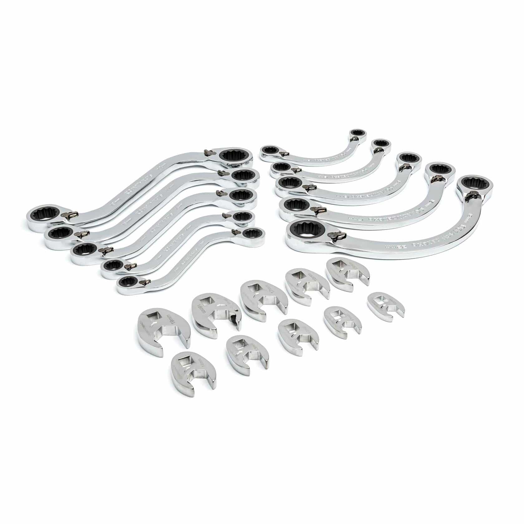 Set of crowfoot wrenches and ratcheting flare nut wrenches arranged in rows; chrome tools designed for tight-space access in automotive or plumbing work.