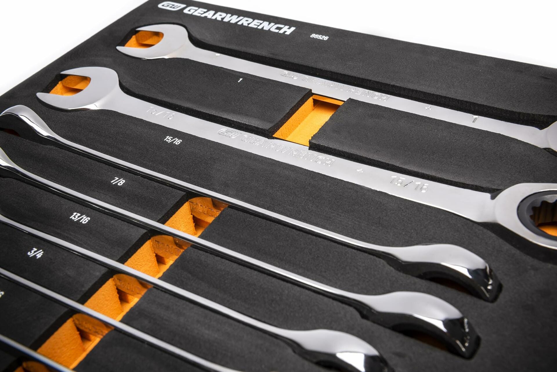 A GEARWRENCH foam tray holding large SAE combination wrenches, labeled with sizes from 3/4 to 1-1/4 inches. Wrenches are arranged in descending order and secured in custom cutouts for modular tool storage.