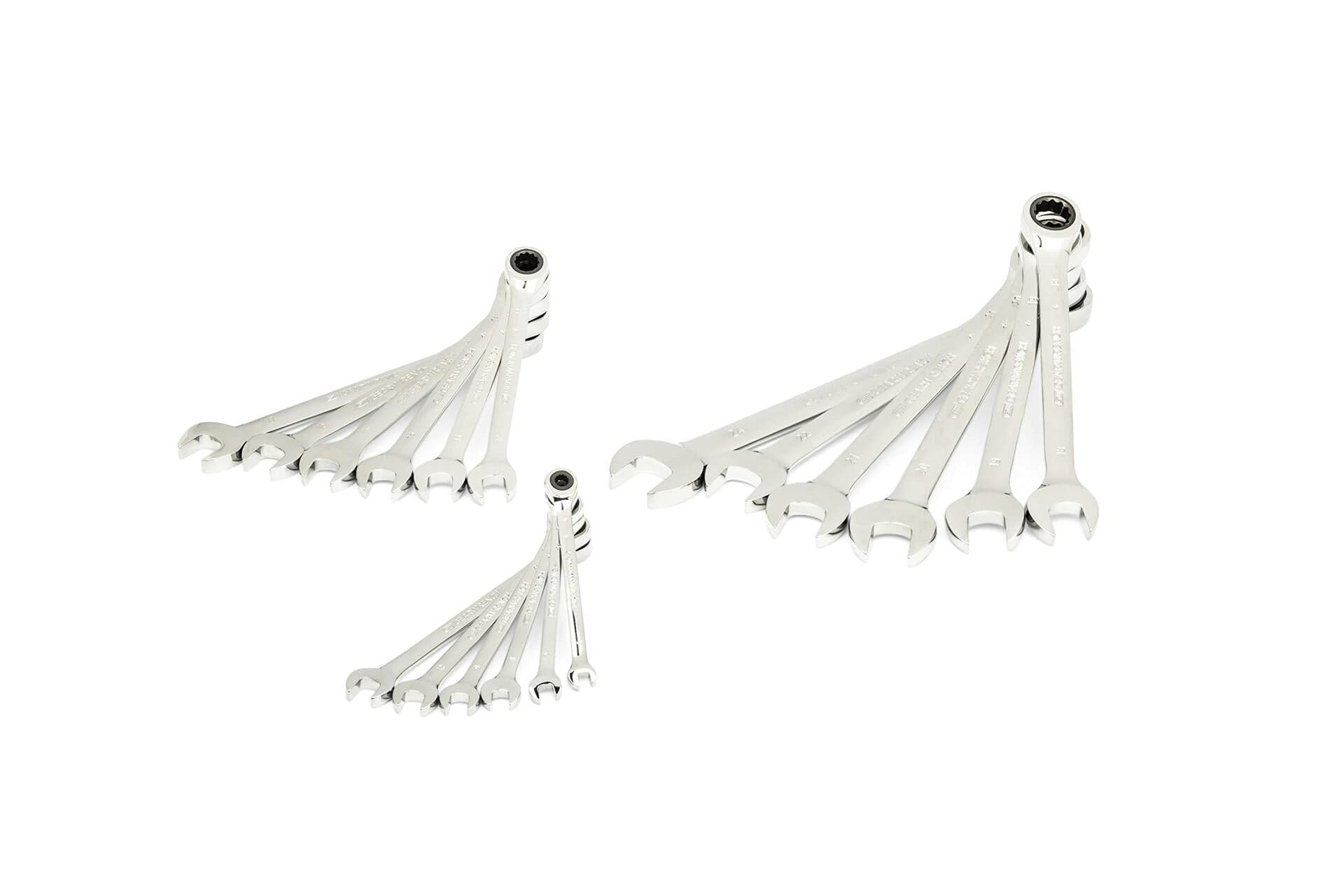 Three sets of polished combination wrenches are arranged in fan patterns by size. Each wrench features an open-end and a box-end, suitable for tightening or loosening fasteners in mechanical work.