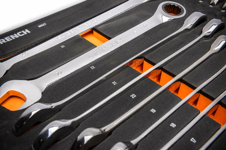  A foam tray labeled “WRENCH 89520” holds a set of polished metric ratcheting wrenches ranging from 16mm to 28mm. Each wrench is secured in a custom slot with orange highlights for visibility. One wrench is etched “GEARWRENCH 22mm.”