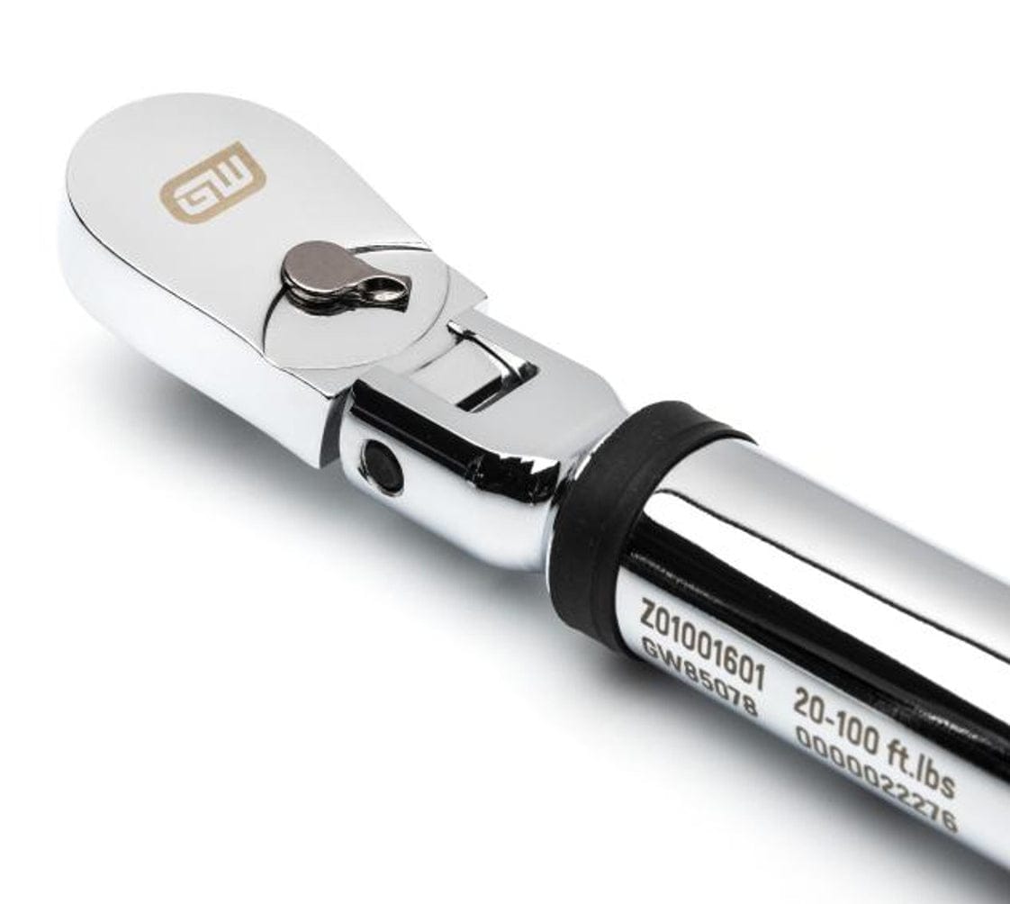 A close-up studio shot of the chrome flex head of the torque wrench, highlighting the 72-tooth ratchet, the quick-release button, and the engraved serial number information.