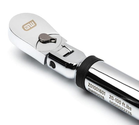 A close-up studio shot of the chrome flex head of the torque wrench, highlighting the 72-tooth ratchet, the quick-release button, and the engraved serial number information.