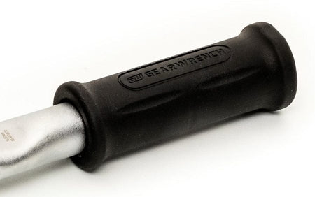 A close-up studio shot of the black rubber handle of the torque wrench, showing the GEARWRENCH logo molded into the grip.