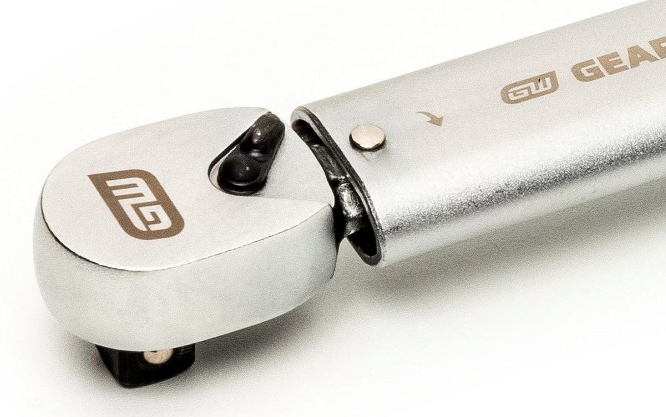 A close-up studio shot of the fixed 3/8-inch drive head of the preset torque wrench, showing the quick-release pin and the mechanism where the head meets the shaft.