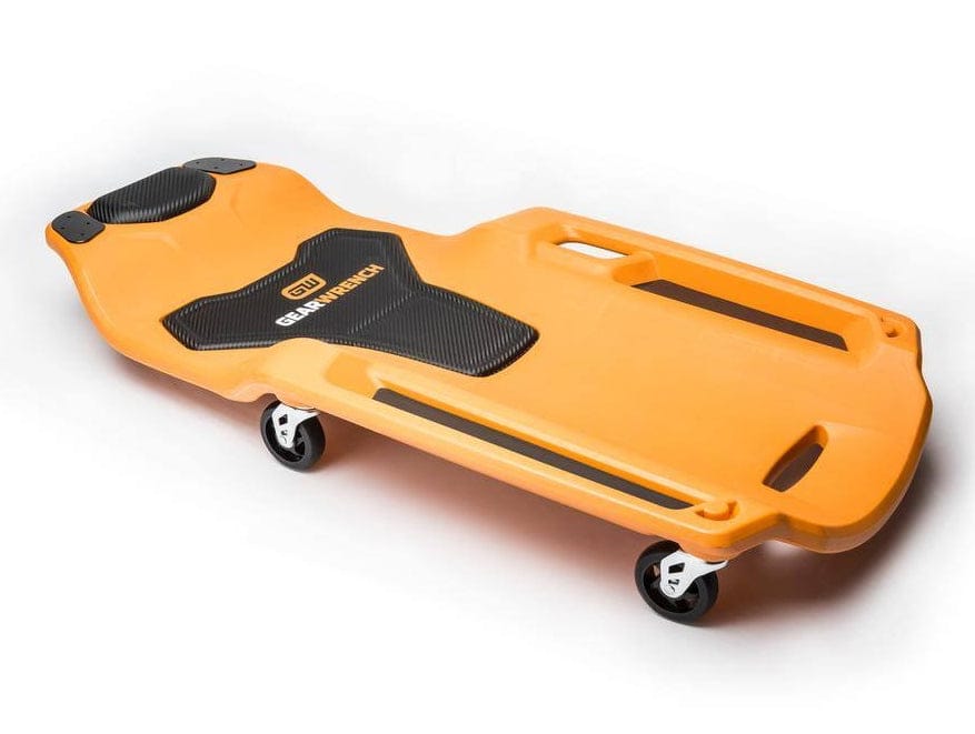 An angled studio shot of the orange GEARWRENCH 41-inch mechanics creeper, showing the overall size, EVA padding, and four of the six swivel casters.