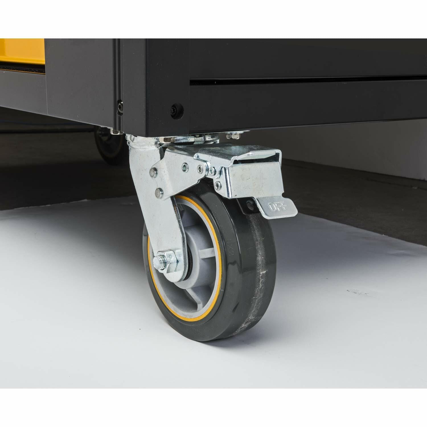 A close-up view of one of the heavy-duty, industrial-grade polyurethane caster wheels of the mobile work station, showing the locking mechanism engaged in the 'OFF' position.
