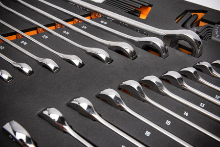  A foam tray containing polished chrome SAE combination wrenches arranged by size from 5/16" to 1". Each wrench is secured in a labeled slot, showing both open-end and box-end sides. The tray is designed for modular tool chest organization.