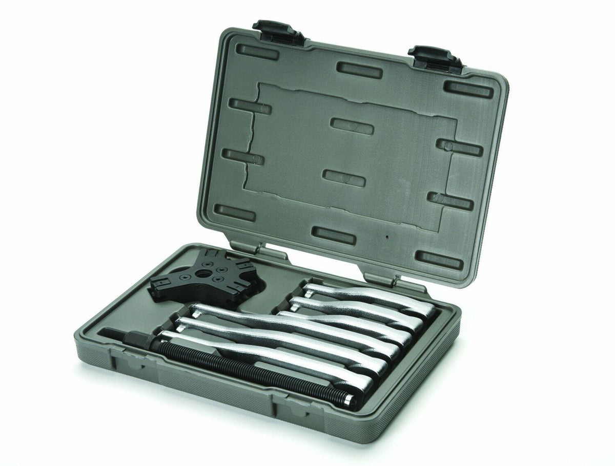 GEARWRENCH puller kit in a molded plastic case. Includes central puller body, multiple curved arms, and threaded screw. Components are organized in fitted compartments for secure storage and transport.