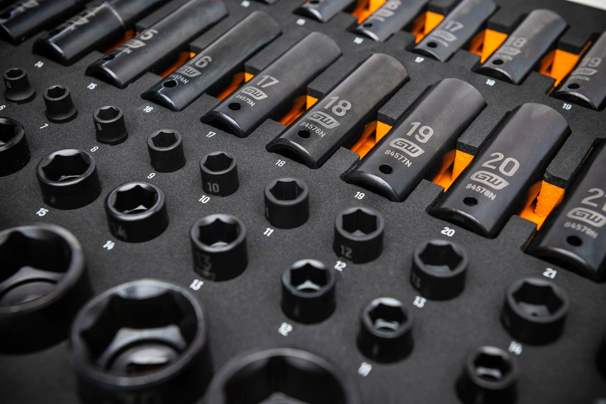 Foam tray containing deep and shallow metric impact sockets labeled from 10mm to 22mm; sockets marked with brand and part numbers for easy identification and organized access