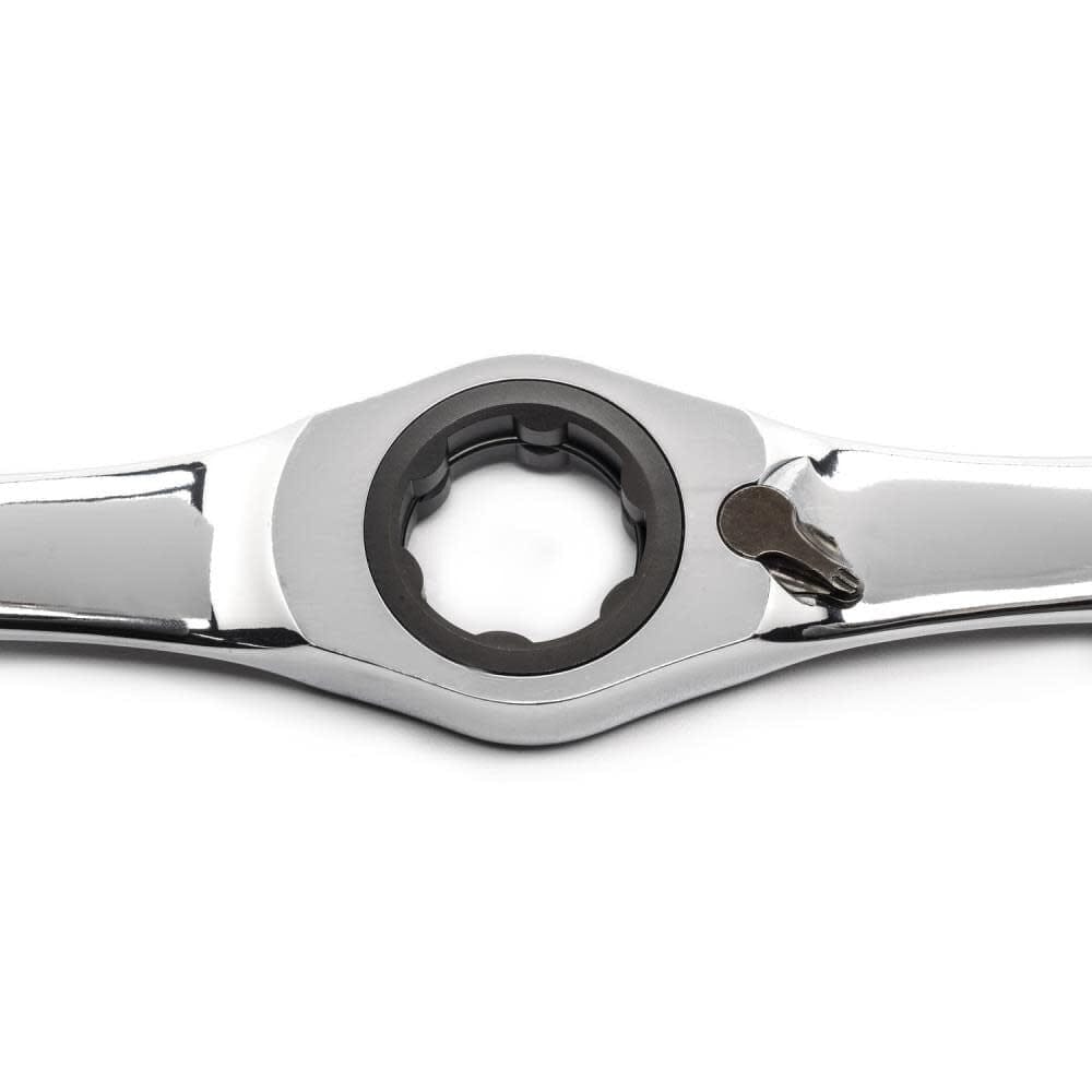 Close-up of a polished metal ratcheting box-end wrench with directional lever, used for efficient fastening in mechanical and automotive applications