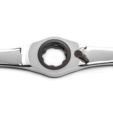 Close-up of a polished metal ratcheting box-end wrench with directional lever, used for efficient fastening in mechanical and automotive applications