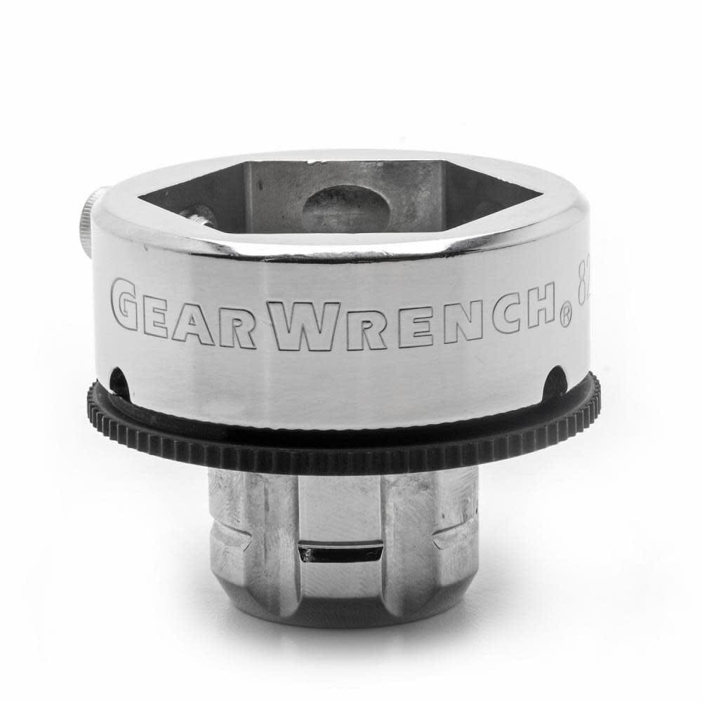 Chrome-finished specialty socket with hexagonal opening and gear mechanism, designed for automotive applications requiring precision and torque.
