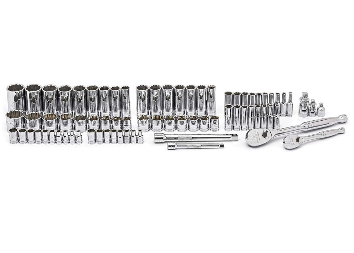 A studio shot displaying the full contents of the GEARWRENCH 80948 set laid out on a white surface, including 1/4 inch and 3/8 inch drive full polish chrome ratchets, extensions, and a complete range of SAE and metric 12-point sockets.