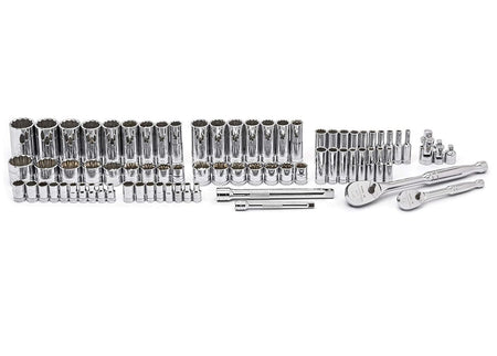 A studio shot displaying the full contents of the GEARWRENCH 80948 set laid out on a white surface, including 1/4 inch and 3/8 inch drive full polish chrome ratchets, extensions, and a complete range of SAE and metric 12-point sockets.