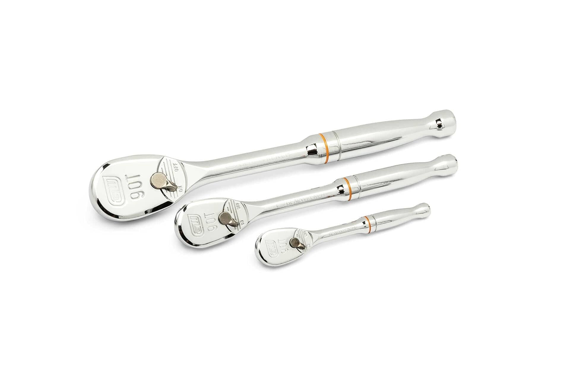 Three polished chrome ratchet wrenches arranged diagonally. Each has a round head with directional switch and square drive. The largest ratchet features an orange ring near the head. Labeled “90T” and “GWD,” indicating tooth count and brand.