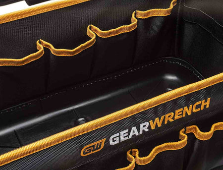 A close-up of the internal compartment of the GEARWRENCH tool tote bag showing the deep pockets and the heavy-duty reinforced molded bottom for superior jobsite durability.
