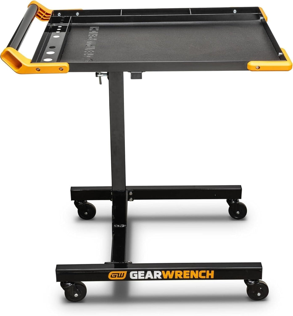 A side profile of the GEARWRENCH 83166 mobile work table featuring a black powder-coated steel frame, a 20x30 inch tray with an EVA mat, and a height-adjustable telescoping pillar on four swivel casters.