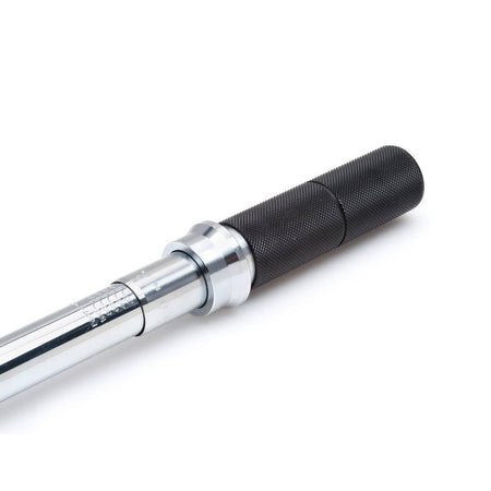 A detailed close-up shot of the micrometer scale markings on the torque wrench shaft, showing clear, high-visibility increments for accurate foot-pound and Newton-meter adjustments.