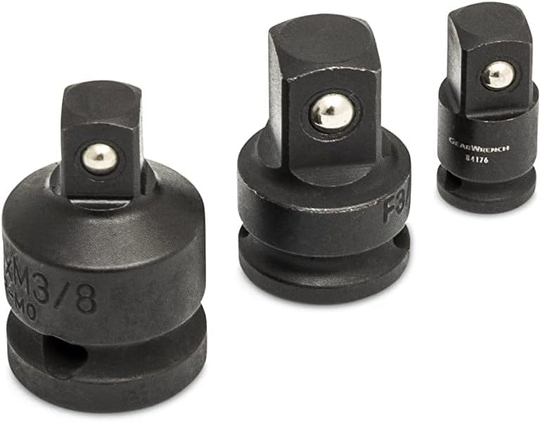 A close-up of three GEARWRENCH impact adapters featuring laser-etched size markings and ball detent mechanisms for secure socket retention during high-torque automotive applications.
