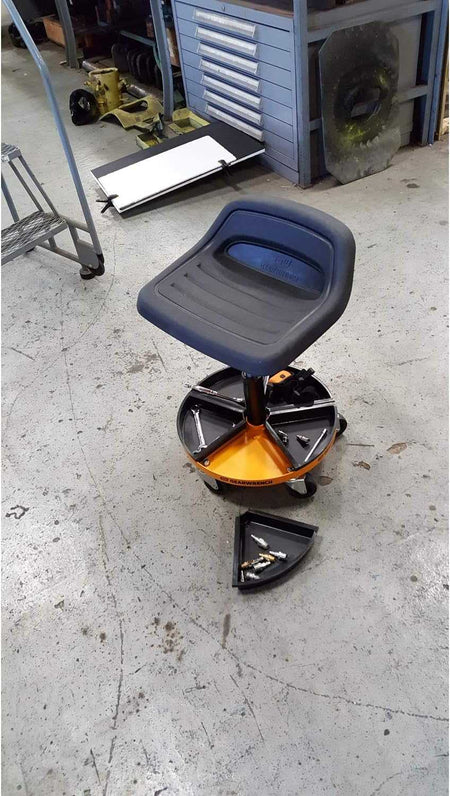 A top-down view of the GEARWRENCH 86994 rolling stool in a workshop setting, illustrating how the five-compartment base keeps wrenches and air fittings organized and within reach.