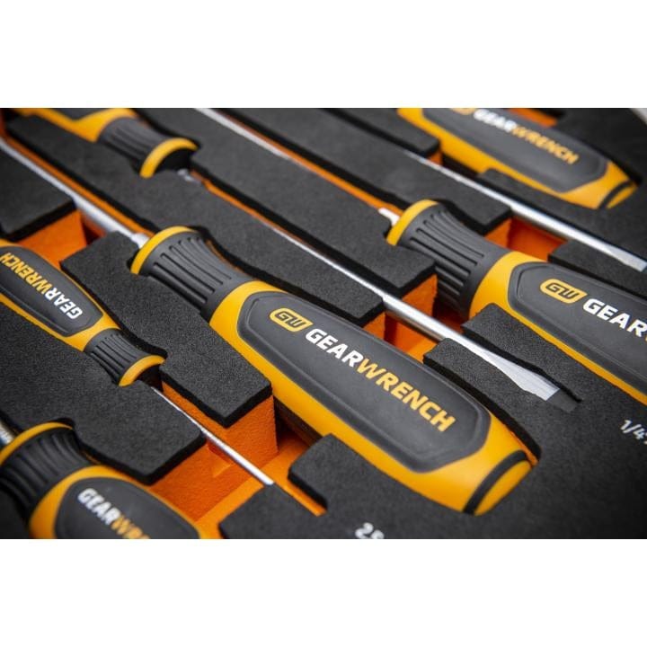 GEARWRENCH screwdriver set arranged in a custom foam organizer with black top and orange base. Each black and yellow-handled tool is securely slotted and labeled, showcasing professional-grade organization.