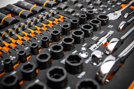GEARWRENCH socket and ratchet set in labeled foam tray with metric and SAE sizes; includes chrome-finished ratchets, extensions, and screwdrivers with black and orange handles.