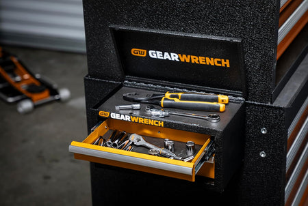 GEARWRENCH mini tool chest with open drawers and top lid showcasing side-mount hook integration on a large roller cabinet for space-saving organization.
