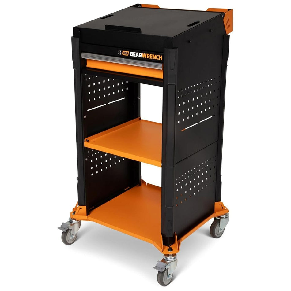 A three-quarter studio perspective shot of the empty GEARWRENCH GWDCART diagnostic mobile workcenter cart showcasing its molten orange shelves and high-gloss black steel structural frame with four swiveling poly caster wheels.