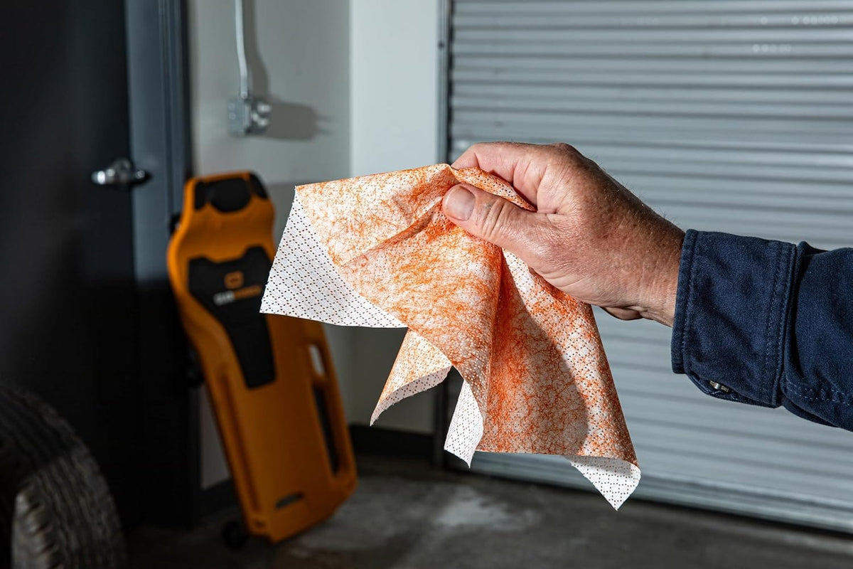 A heavy duty shop wipe features a textured micro-scrubber side for scouring stuck-on soils and a smooth reverse side for residue removal.