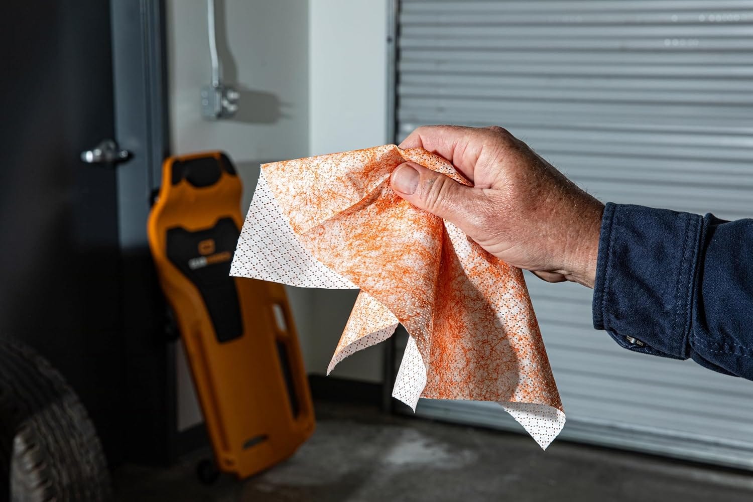 A heavy duty shop wipe features a textured micro-scrubber side for scouring stuck-on soils and a smooth reverse side for residue removal.