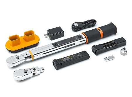 The complete contents of the electronic torque wrench kit laid out, including the wrench body, two interchangeable heads, rechargeable battery, charger, USB cable, and battery holder.