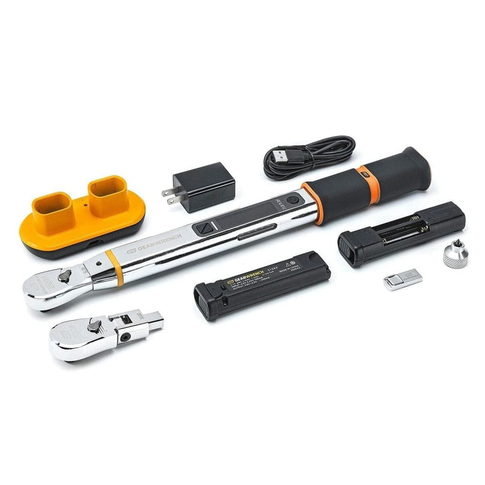The complete contents of the electronic torque wrench kit laid out, including the wrench body, two interchangeable heads, rechargeable battery, charger, USB cable, and battery holder.
