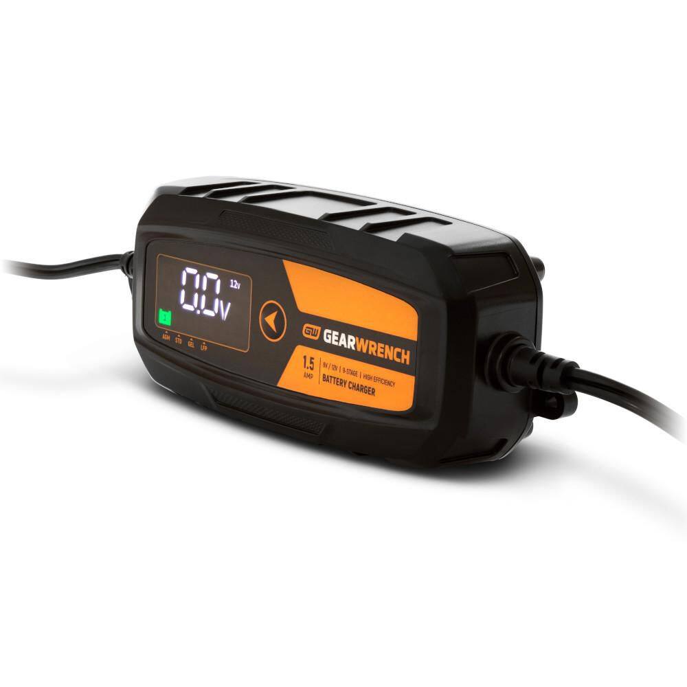 A three-quarter perspective view of the GEARWRENCH battery charger. The shot emphasizes the ruggedized plastic housing and the professional-grade strain relief on the power cables, illustrating the tool's durability for shop environments.