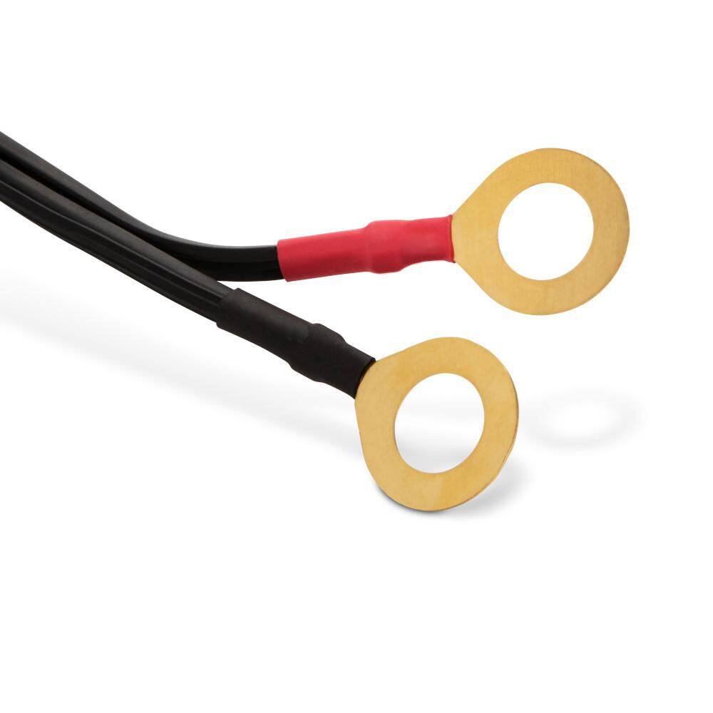 A detailed shot of the permanent ring terminal leads. These gold-plated connectors are designed to be bolted directly to battery terminals for a secure, long-term connection, featuring red and black heat-shrink insulation for polarity identification.
