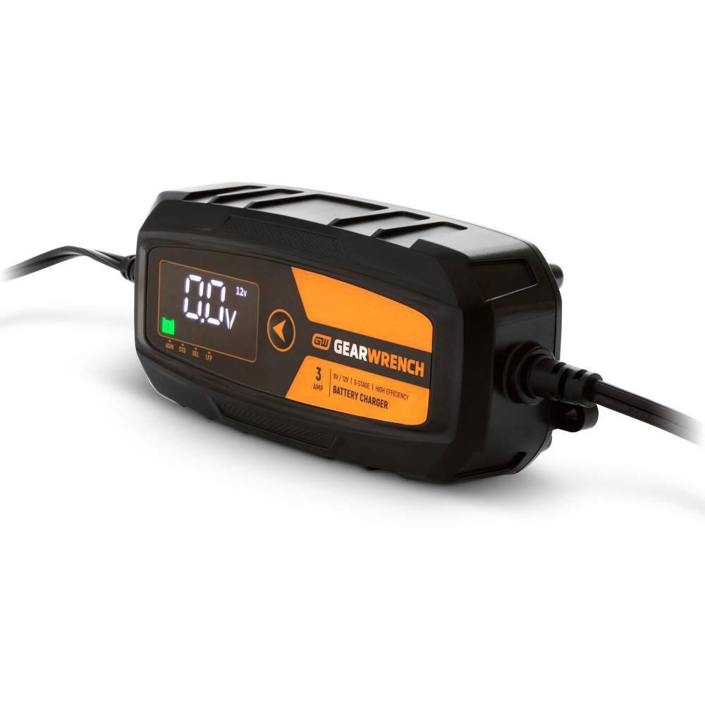 A perspective view of the GEARWRENCH 3 Amp smart battery charger. The shot emphasizes the ruggedized plastic housing and the professional-grade strain relief on the high-reach power cables, illustrating the tool's durability for heavy-duty shop environments.