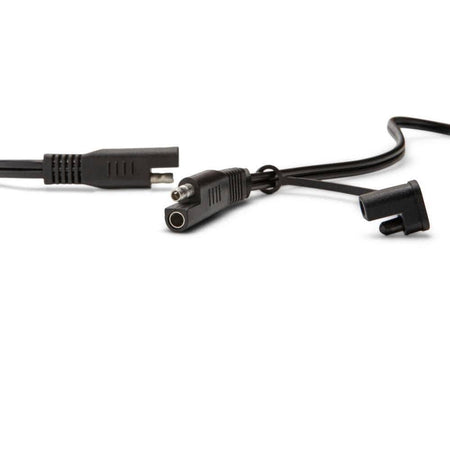 A close-up view of the quick-disconnect terminal system. The image shows the specialized two-pin automotive connectors that allow professional users to easily swap between the heavy-duty terminal clamps and the permanent ring terminal leads.