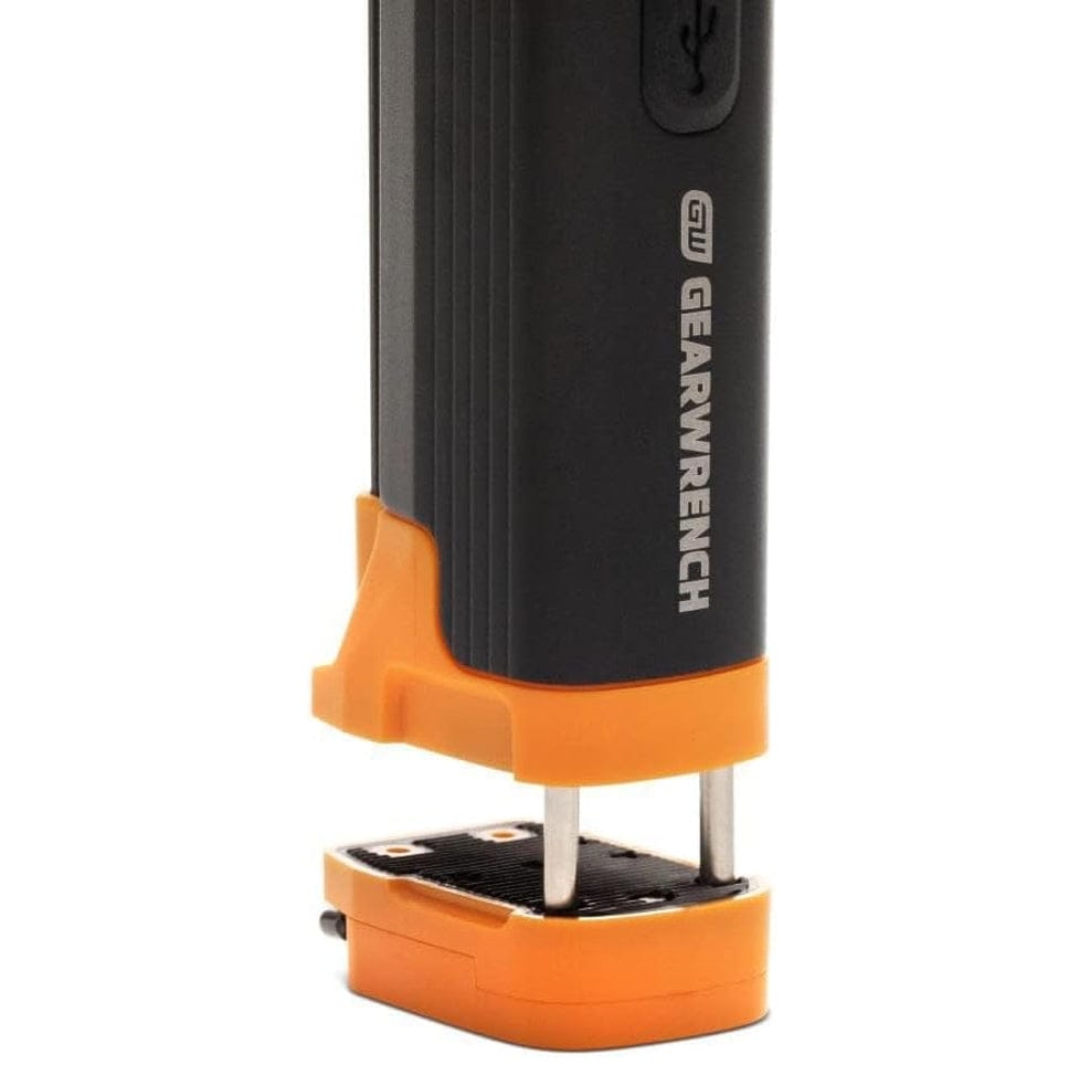Detailed view of the GEARWRENCH work light base featuring an extendable clamp mechanism for secure gripping on non-magnetic surfaces during inspection.