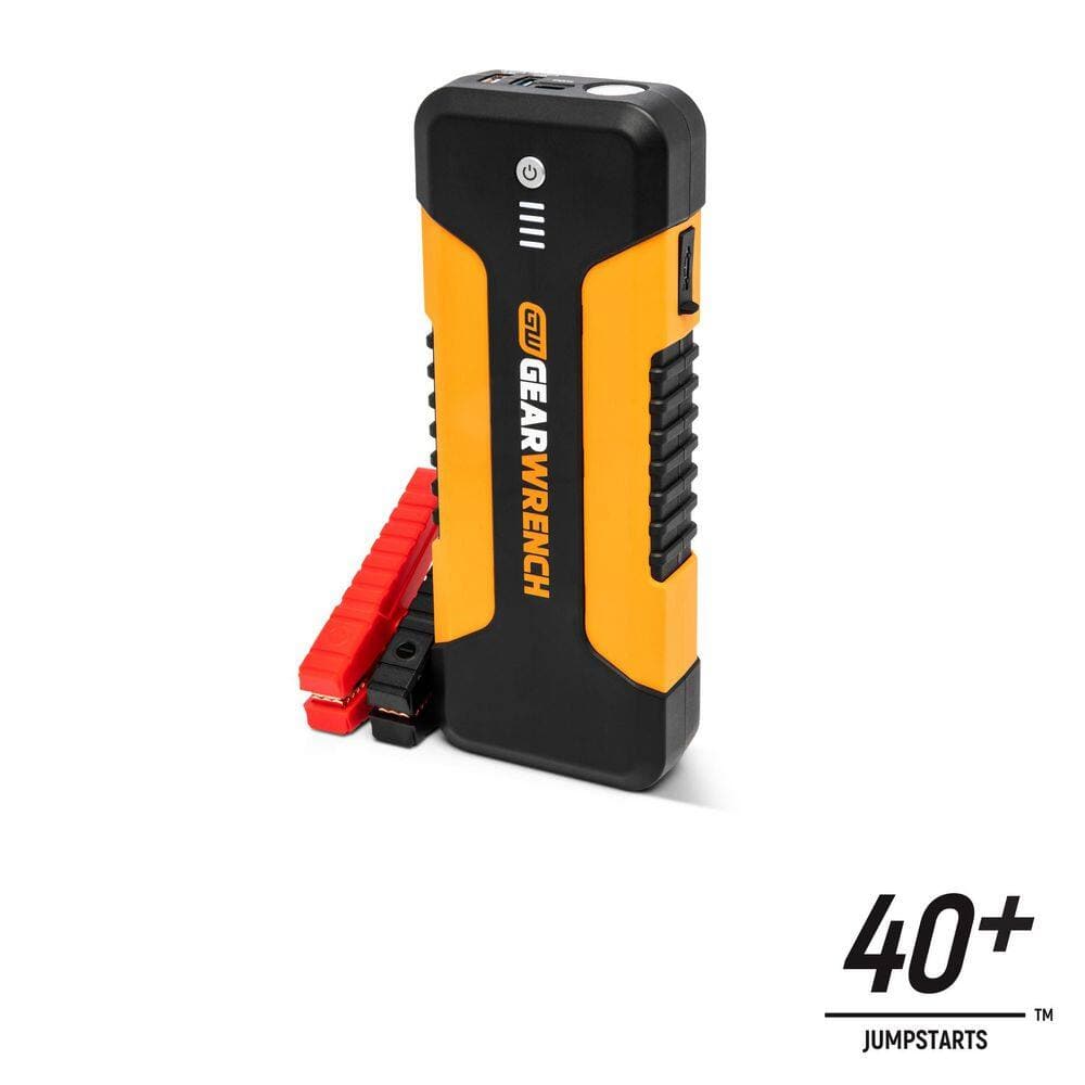 A studio product view of the GEARWRENCH GWLBJ20 12V lithium ion battery jump starter shown vertically. The portable unit features a molten orange and black high-impact housing, an integrated power level indicator, and is shown with a 40 plus jumpstarts graphic icon.