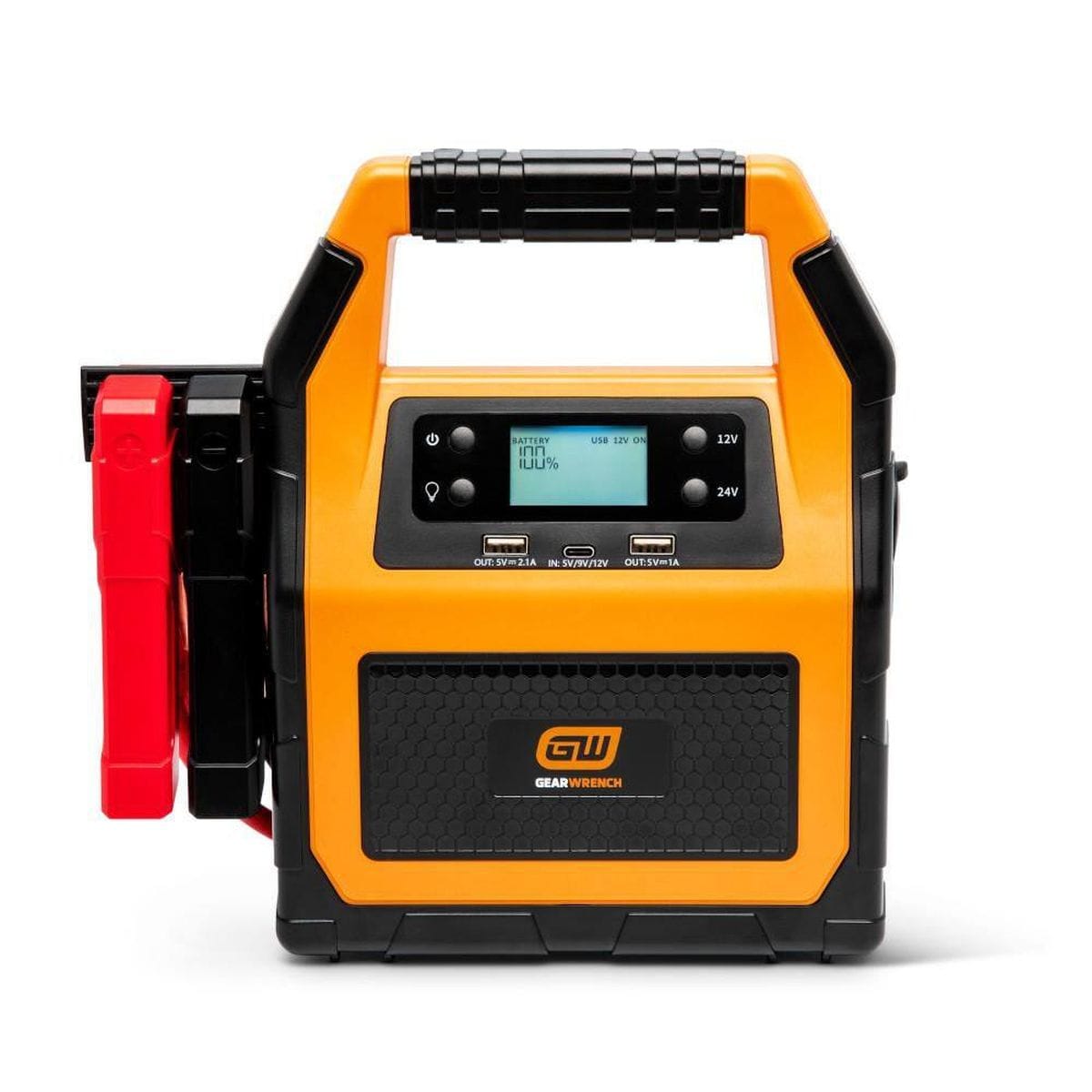 A front studio view of the GEARWRENCH GWLBJ30 12V/24V lithium battery jump starter. The portable unit features a durable molten orange and black housing with an integrated carrying handle, an LCD digital display, and side-mounted heavy-duty battery clamps.