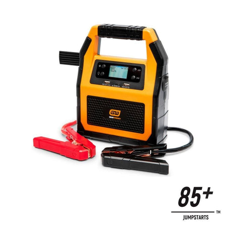 A perspective view of the GEARWRENCH 3000 amp jump starter with the red and black jumper cables extended. A graphic overlay indicates the high-capacity lithium battery is capable of 85 plus jump starts on a single full charge.