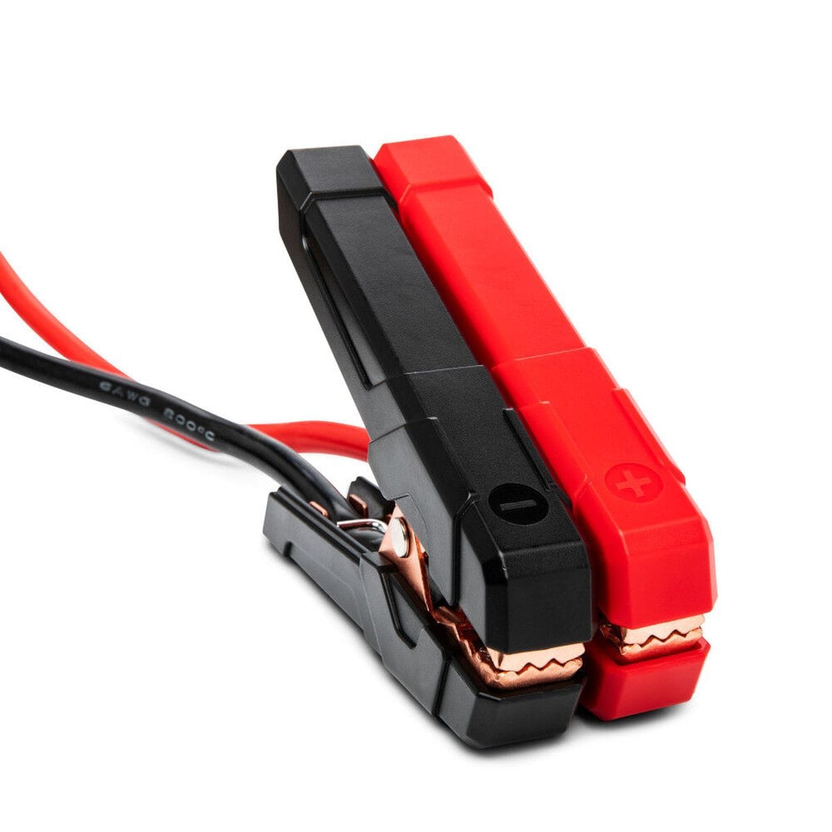 A close-up detail shot of the GEARWRENCH heavy-duty jumper clamps. The image highlights the professional-grade copper teeth and low-profile black and red insulated grips designed for secure connection to automotive battery terminals in tight engine bays.