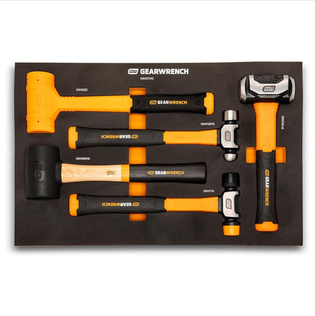 Overhead flat lay view of the GEARWRENCH GWH5PCMS five-piece mixed hammer set organized inside its custom-cut black and orange shadow foam storage tray, showcasing the rubber mallet, soft-face, dead blow, ball pein, and heavy drilling hammers.