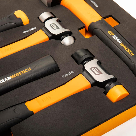 A macro close-up view focusing on the dual-function ball pein, soft tip, and high-force drilling hammer heads nested in the protective closed-cell black foam tray inserts to illustrate technical model labeling.