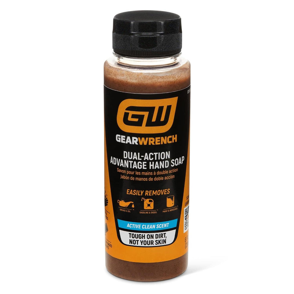 An 8 ounce clear plastic squeeze bottle of GEARWRENCH Dual-Action Advantage Hand Soap with a black flip top cap. The orange and black label indicates the heavy duty pumice and clay formula is designed to easily remove automotive grease, oil, gasoline, diesel, paint, and adhesives from skin while featuring an active clean citrus scent.