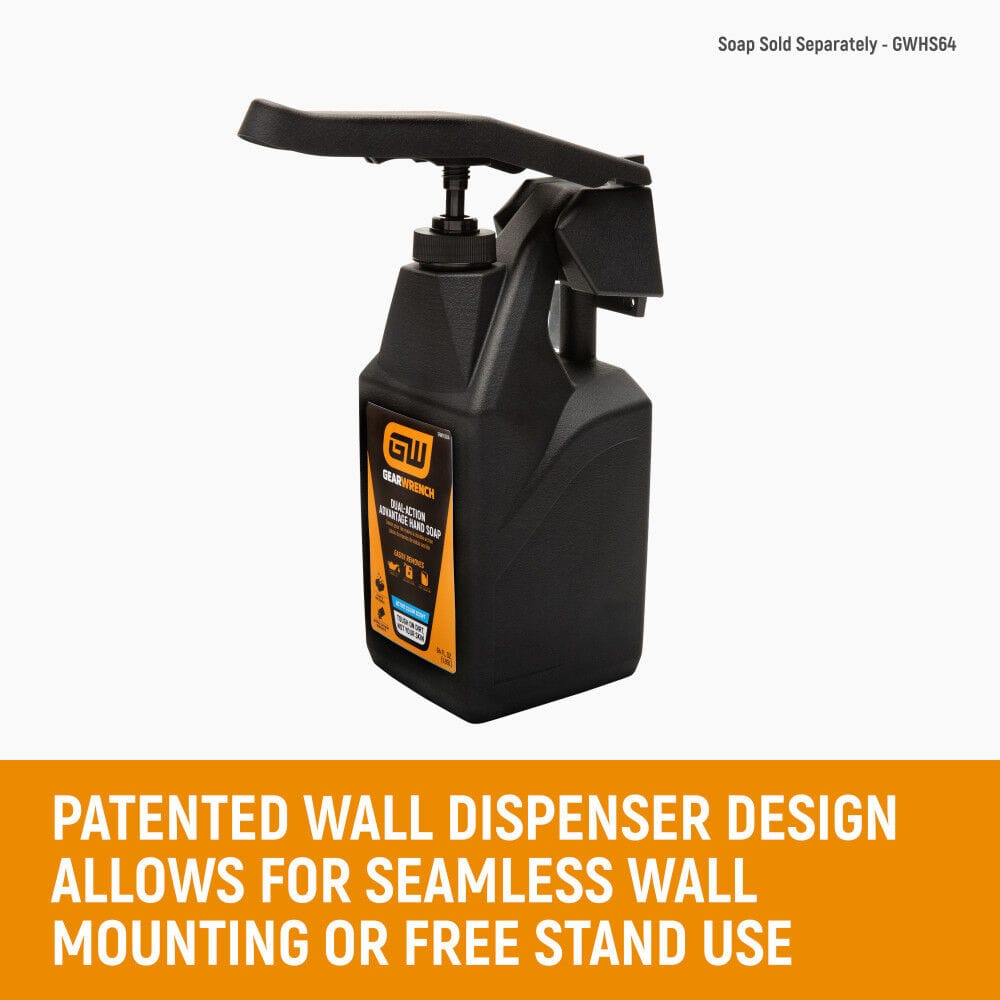 GEARWRENCH GWDHS 64 ounce heavy duty hand soap wall dispenser assembly holding a black rectangular squeeze bottle with an attached dispensing pump handle lever arm. The black plastic mounting bracket bracket is configured for vertical wall installation or free standing counter use, shown above text detailing the patented dual deployment design.