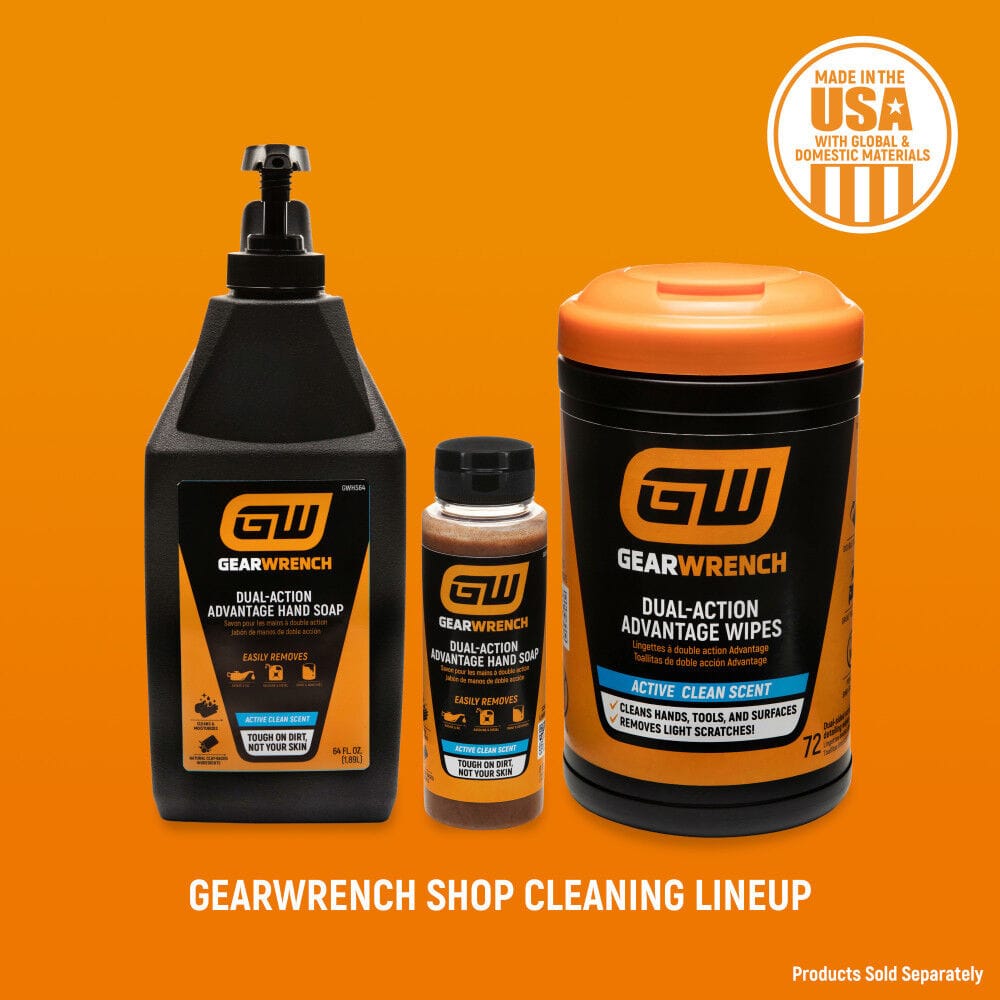 GEARWRENCH shop cleaning lineup display showcasing a 64 ounce dual action advantage hand soap bottle with a top pump, a compact 8 ounce squeeze bottle, and a 72 count heavy duty hand wipe canister container. The products are arranged on a bright orange promotional background with a circular Made in the USA emblem badge.