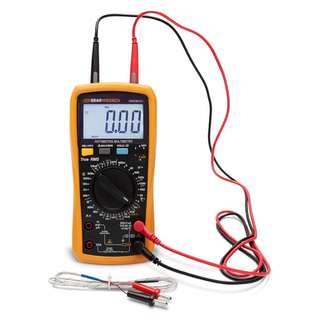 GEARWRENCH automotive digital multimeter GWDM107 with red and black CAT IV test leads connected to the bottom ports, accompanied by a temperature thermocouple accessory resting on the surface.